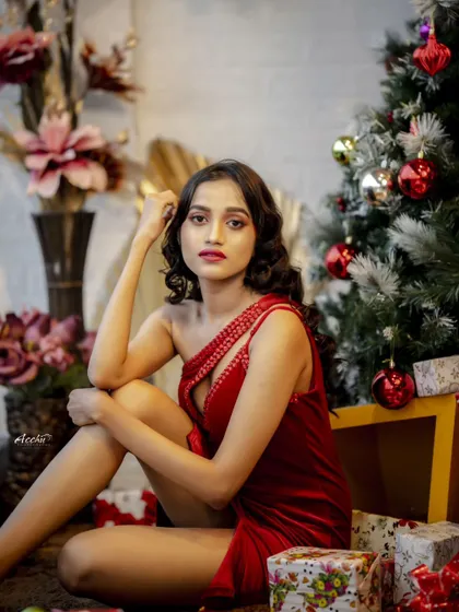 Another beautiful portrait from this series, capturing a quiet and elegant moment amidst the festive decorations.