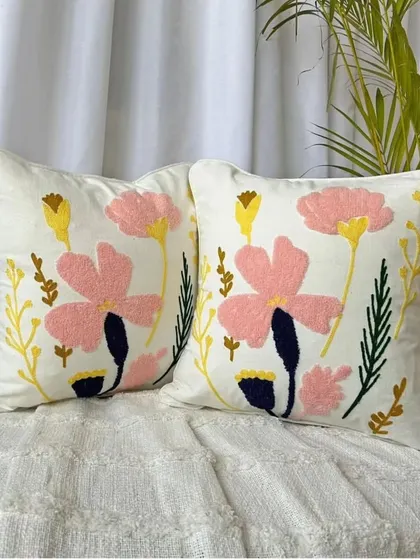 A pair of our floral embroidered cushion covers, perfect for creating a balanced and cohesive look on your bed or sofa.