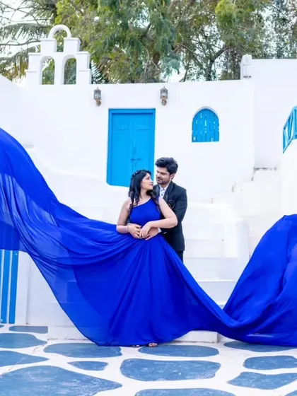 The full, dramatic spread of the royal blue flying gown. This is a perfect example of how these gowns can transform a photo into something truly spectacular.