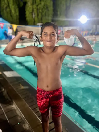 Indradutt N R proudly shows his strength after securing a Silver Medal in the 50m Breast Stroke at the State Aquatic Championship.