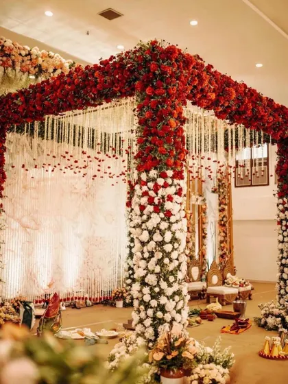 A magnificent mandap made entirely of red and white roses. This is the ultimate statement of romance and luxury for a wedding ceremony.
