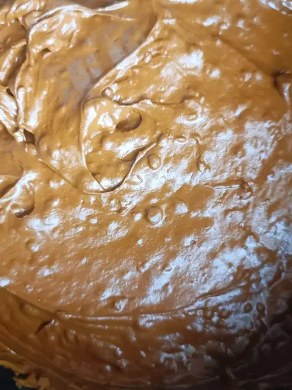 Look at the texture of this freshly made henna paste. It's thick, smooth, and ready to be put into cones. This quality is what gives you a dark, beautiful henna stain.