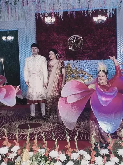 Another beautiful lotus entry, this time with a mix of costume colors. We customize our performances to perfectly match your wedding's decor and theme.