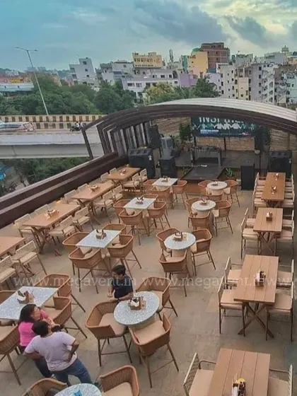 Another angle of the rooftop restaurant, showing how the space is designed to maximize seating and views, with our furniture providing comfort and style.