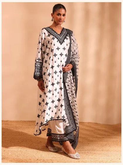 This black and white printed kurta set is a bold and modern choice. The geometric print and contrasting borders make it a true statement piece.