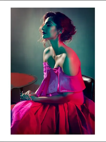 A portrait of Sonam Kapoor where color tells the story. The use of pink and green lighting gels paints the scene with mood and drama, transforming a simple pose into a piece of art.