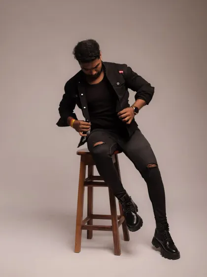 A seated pose on a stool, showing a different level and perspective for added variety in a portfolio.