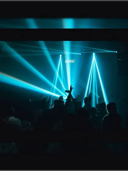 A sea of hands in the air under sharp blue beams of light. This is the visual feedback that tells me the journey is hitting all the right notes.