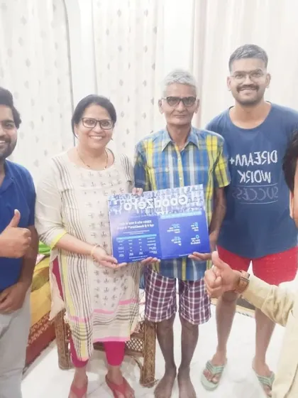 A family holds our "GoodZero" brochure, excited about the guaranteed savings. We deliver on our promises.