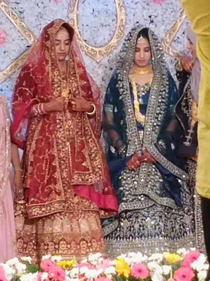 Two brides on stage in their beautiful and distinct wedding outfits. I offer remarriage support for divorcees and widows, helping them find a new beginning.