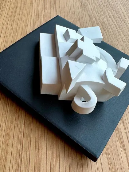 A small, complex model of the Gehry building, capturing its deconstructed forms.