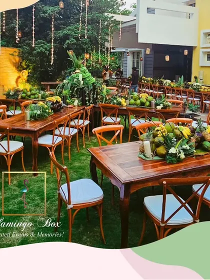 I paired rustic wooden tables and cross-back chairs with the organic decor to complete the farm-to-table aesthetic. The natural grain of the wood perfectly complemented the fresh produce.
