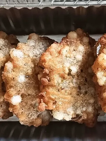 A container of my crispy Sabudana Tikkis, ready to be enjoyed with a side of chutney. A favorite snack for all ages.