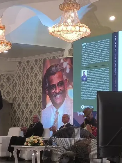 A moment from the book launch ceremony, with clear audio and professional stage lighting.