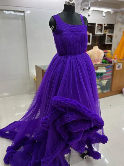 Another angle of the purple gown, showing the pleated bodice.