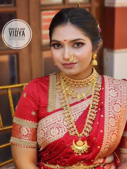 A close-up of Priya's bridal makeup by my artist Vidya. The look features defined eyes, a traditional bindi, and beautiful layered necklaces.