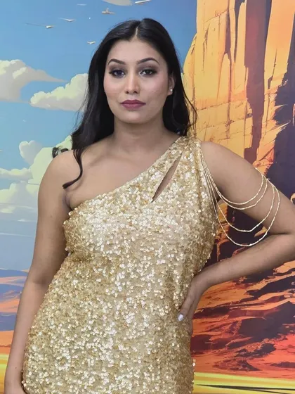 This gold sequin one-shoulder dress is accessorized with a unique, modern armlet. I can create all kinds of custom pieces beyond traditional necklaces and earrings.