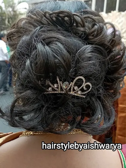 A curly and textured messy bun for short to medium-length hair. I added a small, sparkly crown clip to give it a touch of glamour for this special event.