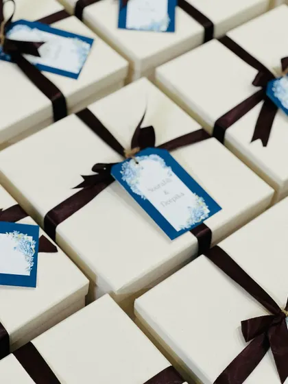 An angled shot of the personalized gift boxes, showing the beautiful calligraphy on the name tags.