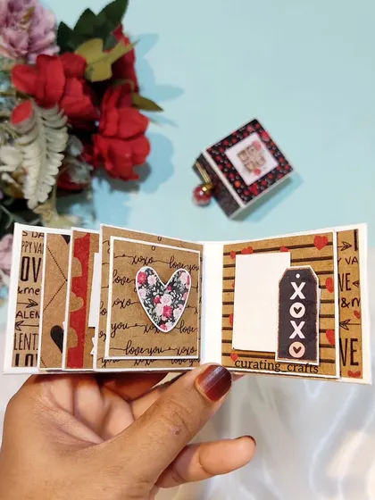 A tiny scrapbook with a rustic brown paper and "XOXO" theme.