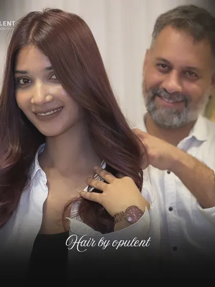 You pictured it, and I made it real. This client is thrilled with her new reddish-purple hair color, a bold choice that perfectly matches her vibrant personality.