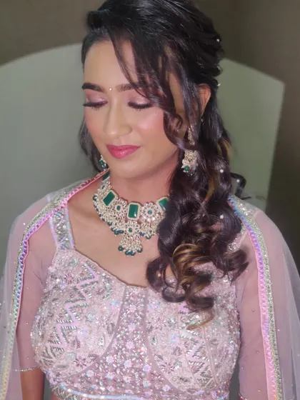 A close-up of the soft, shimmery eye makeup and glossy lips.