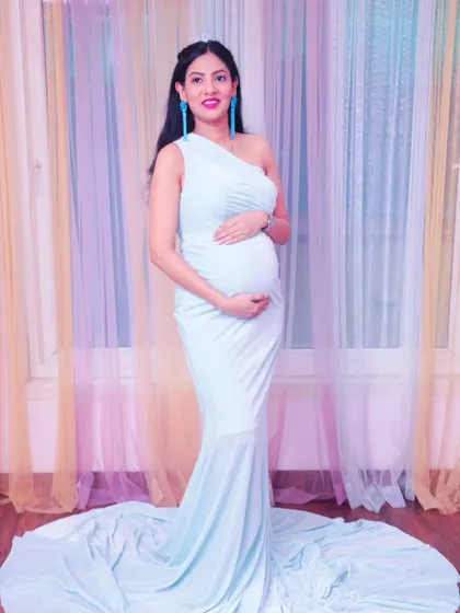 Another beautiful full-length portrait showcasing the flowing aqua gown. We experiment with different lighting to create the perfect mood for your photos.