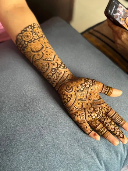 This is a detailed view of my intricate bridal henna work. Each design is unique, combining traditional patterns like paisleys and mandalas with fine-line fillers to create a stunning, full-coverage look for your special day.