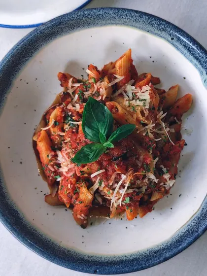 A classic penne arrabbiata, done my way. It's simple, spicy, and always satisfying. A little sly, a lot delicious.