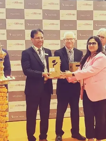 A dignitary receives a token of appreciation during the felicitation ceremony.
