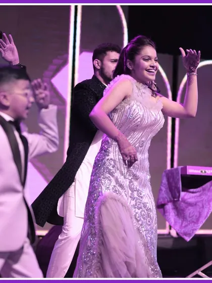 The bride and her friends enjoying their performance on the Sangeet stage. These are the moments of pure joy we love to create.