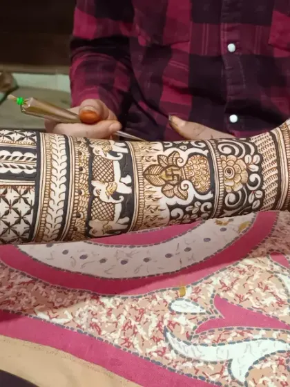 Here you can see the fine line work and different patterns I use, from floral bands to geometric checks, to create a balanced and intricate bridal arm design.