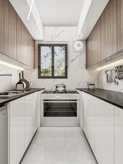 A compact galley kitchen designed for maximum efficiency, with white handleless cabinets, a marble-patterned backsplash, and under-cabinet lighting.