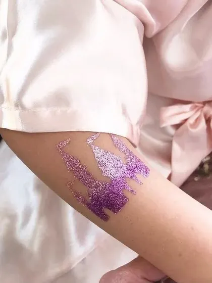 A sparkling purple castle tattoo, fit for a prince or princess. This is a great addition to any fairytale-themed party.
