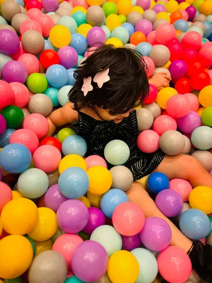 Just floating in a rainbow of balls. It's a perfect spot for kids to relax and play.