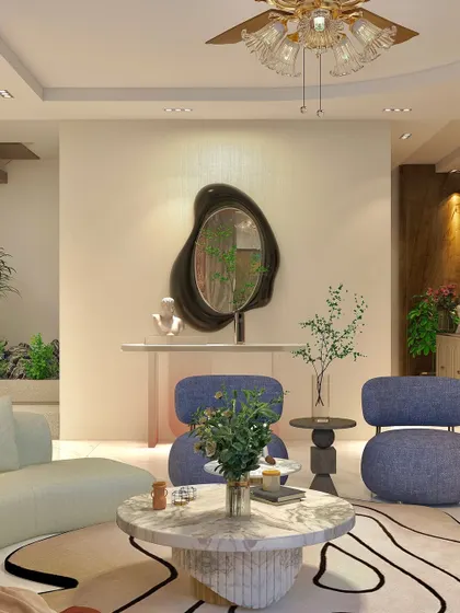 This corner features a unique, organically shaped mirror and modern blue armchairs, showcasing our flair for curating artistic and functional pieces.