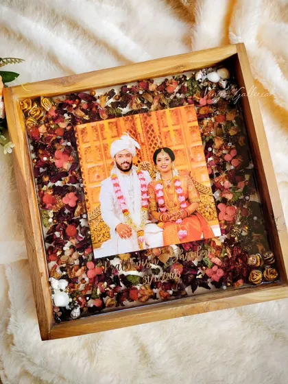 This frame is a perfect example of sealing memories for a lifetime. The client wanted full coverage of her old mala, and I enhanced it with red hydrangeas and gold chunks to create this beautiful piece.