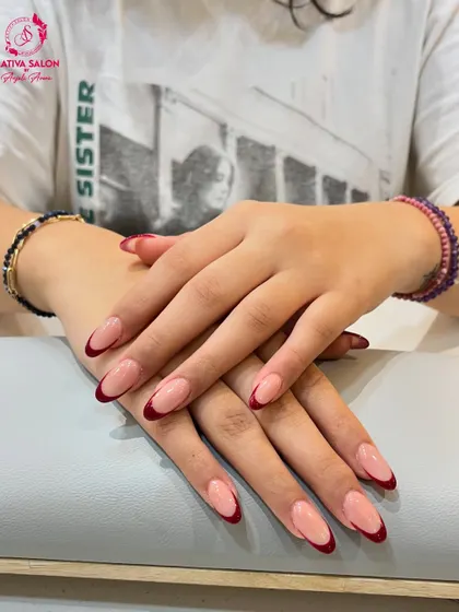 Another angle of our popular red-tipped French manicure. The clean lines and rich color make this a standout choice for anyone looking to update a classic style.