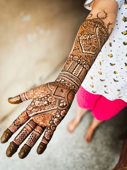 The palm side of the large paisley design, showing a different set of intricate patterns.