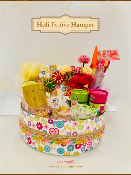 A cheerful and floral-themed round hamper for Holi. This box is filled with colorful items and treats, making it a delightful gift for friends and family.