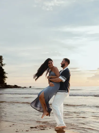 The pure, uninhibited joy of an elopement shoot. We captured this playful lift on the shores of Phuket, a perfect example of the laughter and friendship that are at the heart of every love story we tell.