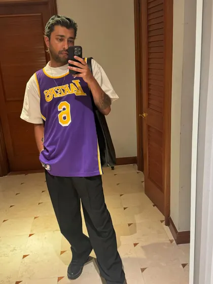 Rocking a classic Lakers jersey. My love for basketball and streetwear often finds its way into my style.