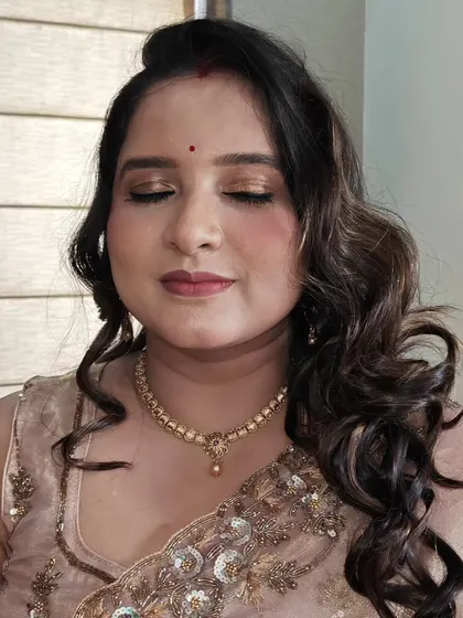 A close-up of the golden-bronze eye makeup. These tones are universally flattering and perfect for Indian festive wear.