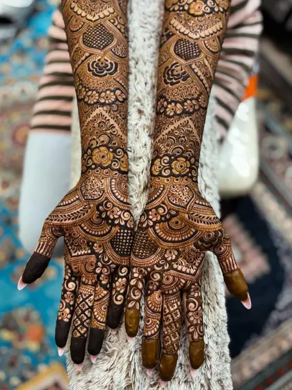 The full view of this engagement design, showing the intricate details on the palms and fingers.
