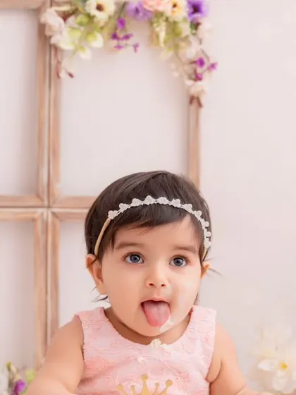 A cheeky and playful close-up from a first birthday cake smash session. It’s these little expressions that tell the biggest stories.