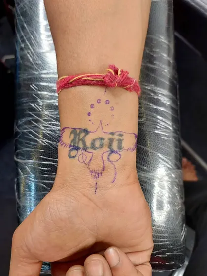 Before: This client had a name tattoo on their wrist that they wanted to replace with something new.