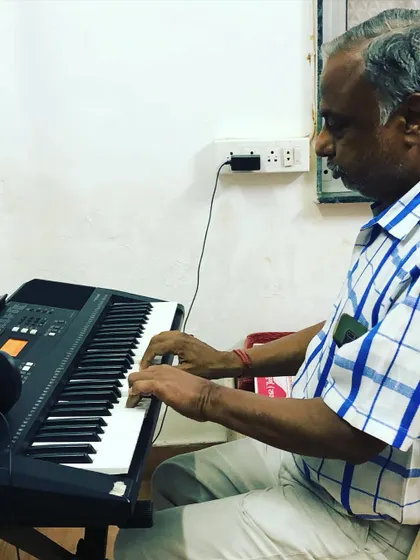 Another shot of our senior student deeply focused on his keyboard practice. His dedication is an inspiration to students of all ages in our community.