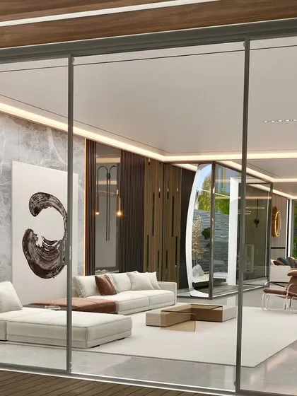 Minimalism is the art of making a space feel complete without overdoing it. This interior, viewed through large glass sliders, speaks volumes about balance, where every detail has a clear purpose.