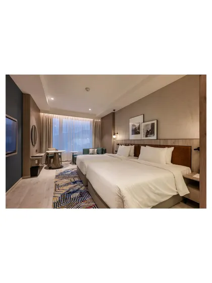 Additional views of the Radisson Resort, Khopoli, showcasing various interior and exterior details, from lobby seating areas and restaurant layouts to guest room configurations and architectural elements.