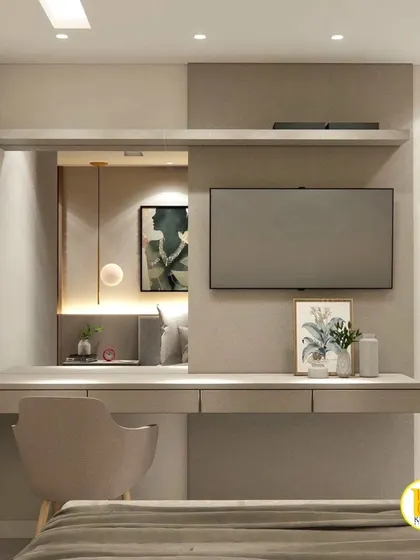 A bedroom with an integrated desk and TV unit, showing a reflection of the bed in the mirror.